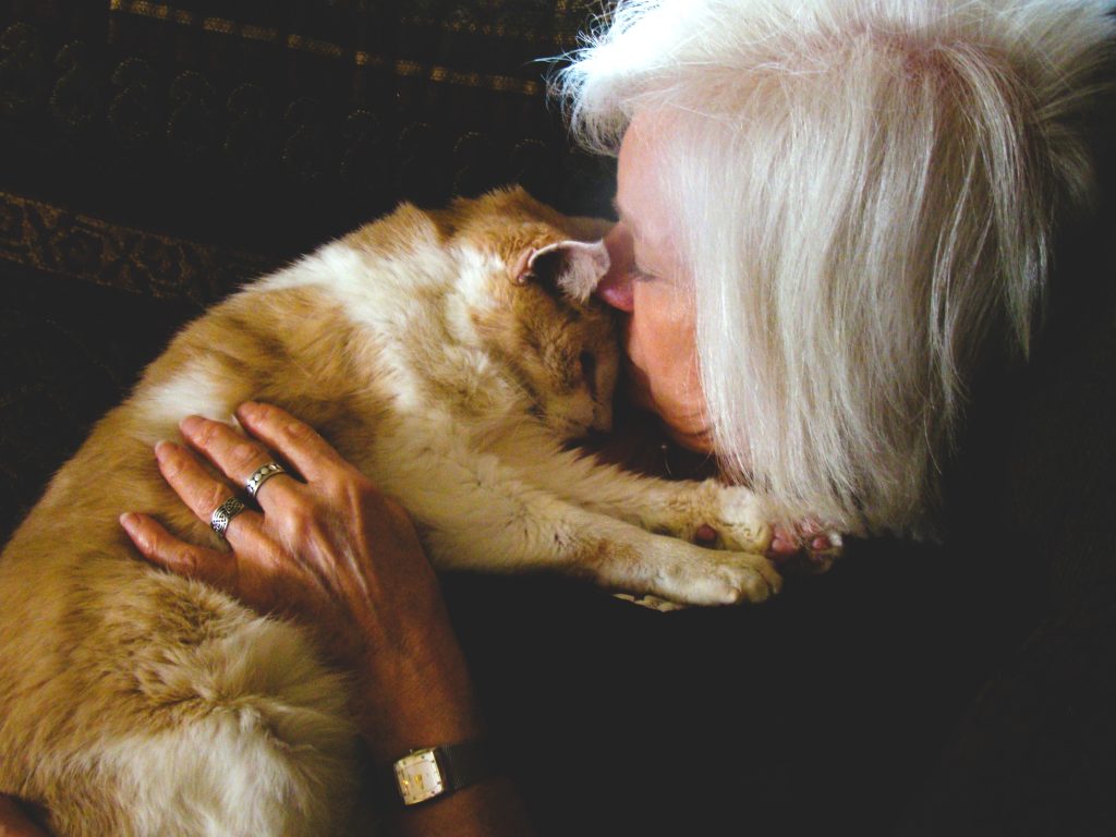 Gail Pope snuggling with a old cat