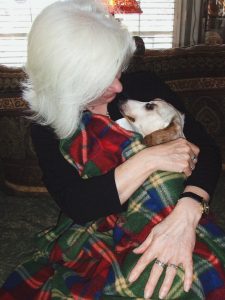 Gail Pope snuggling with a very sick dog